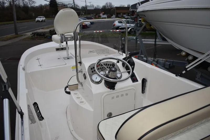 Slide: The Image of 2023 Carolina Skiff 192 JLS boat interior with steering console and seating. - 4