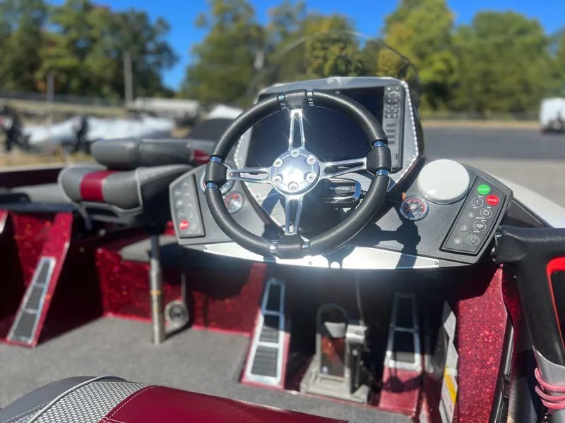 Slide: The Image of 2020 Ranger Z520C boat dashboard with steering wheel and control panel. - 12