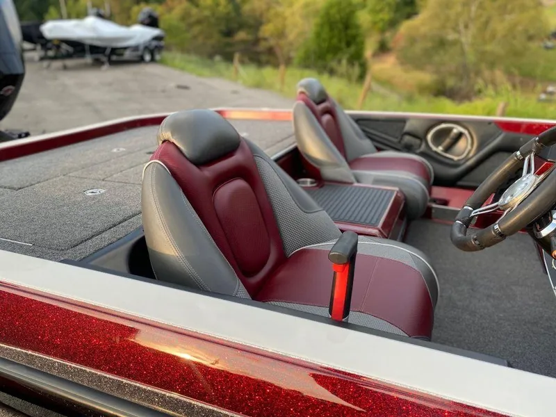 Slide: The Image of 2020 Ranger Z520C boat interior with red and gray seats, steering wheel visible. - 7