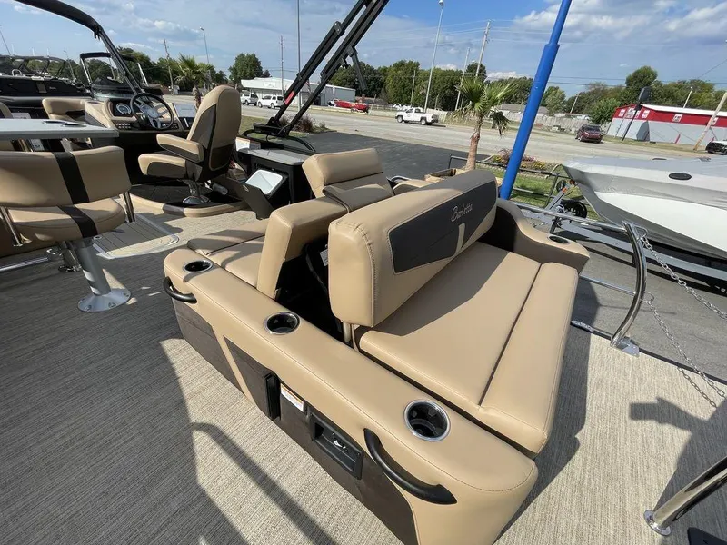 Slide: The Image of 2023 Barletta Cabrio 24 UE boat interior with tan seating and cup holders. - 23