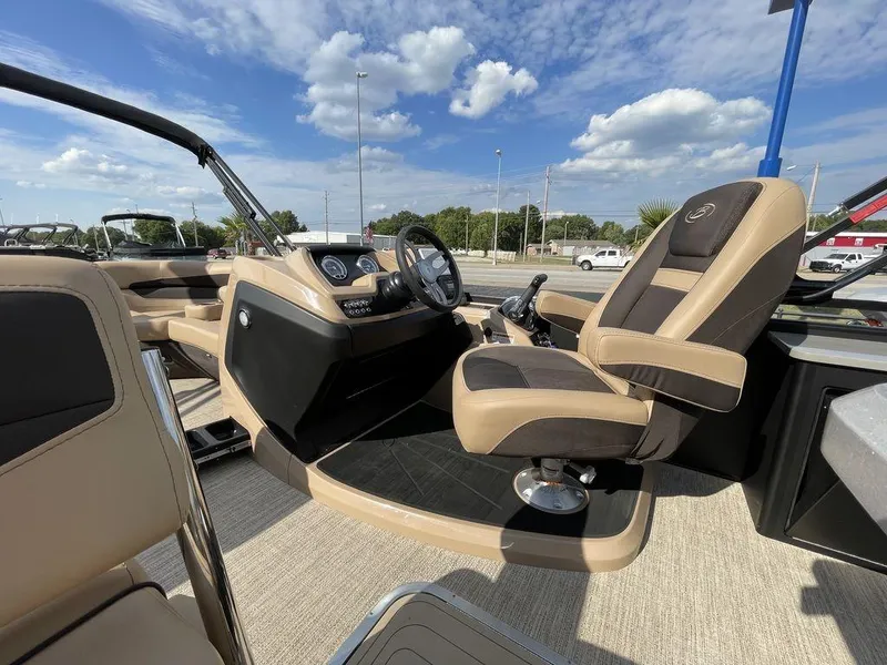 Slide: The Image of 2023 Barletta Cabrio 24 UE boat interior with captain's chair and control console. - 26