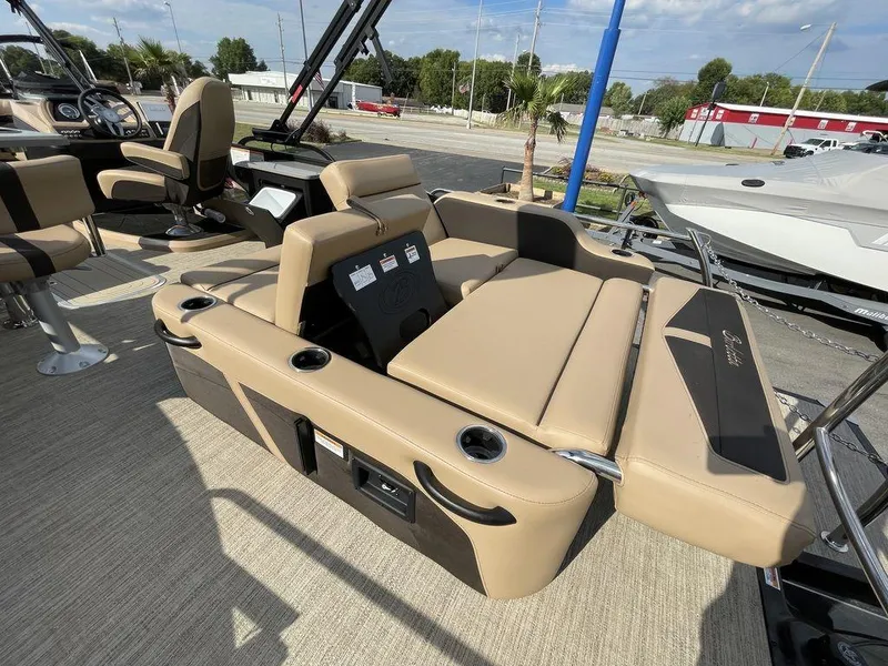 Slide: The Image of 2023 Barletta Cabrio 24 UE boat interior with tan seating and cup holders. - 29