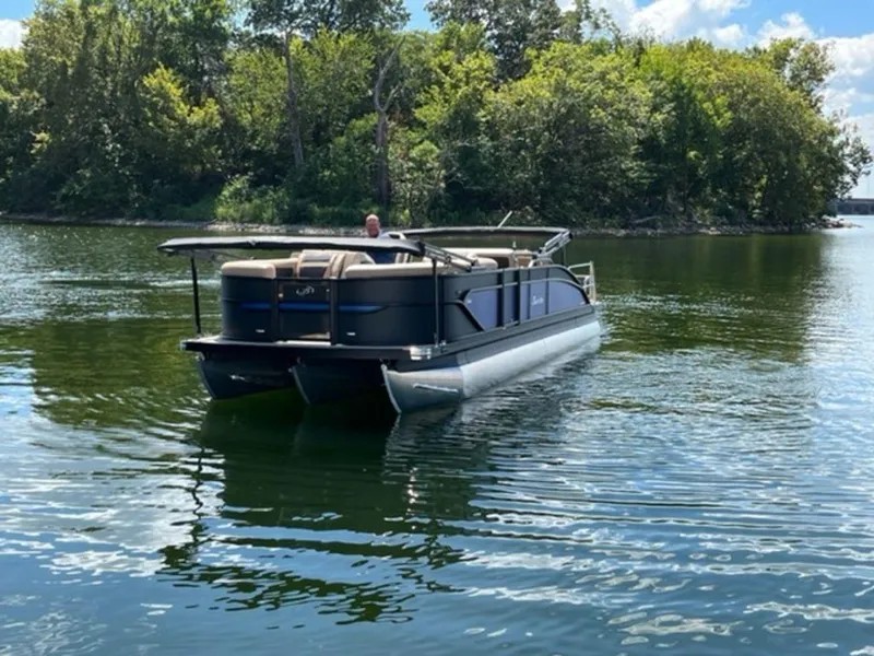 Slide: The Image of 2023 Barletta Cabrio 24 UE pontoon boat on a serene lake. - 3