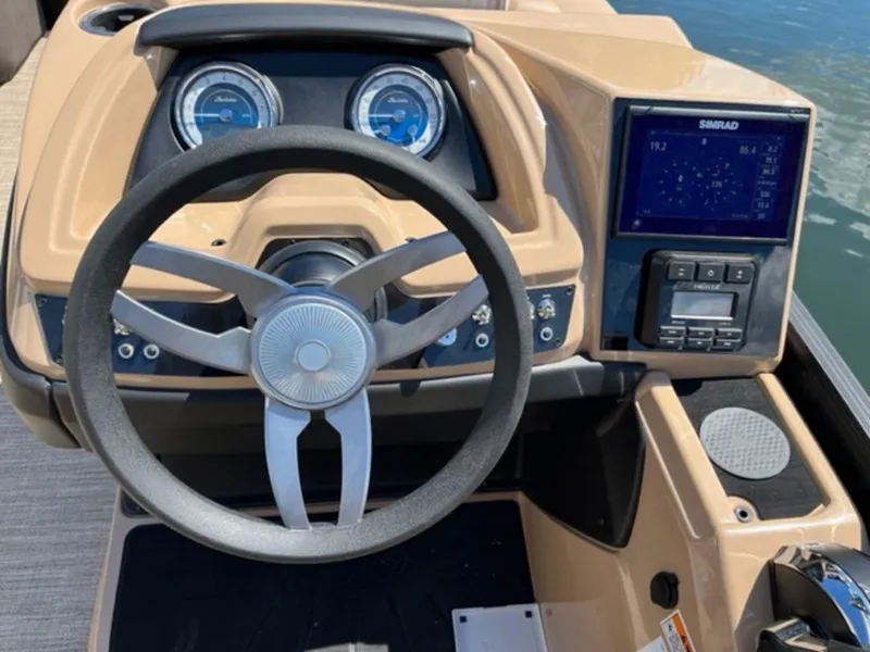 Slide: The Image of 2023 Barletta Cabrio 24 UE boat dashboard with steering wheel and navigation system. - 31
