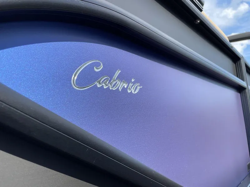 Slide: The Image of Close-up of 2023 Barletta Cabrio 24 UE boat with blue metallic finish. - 39
