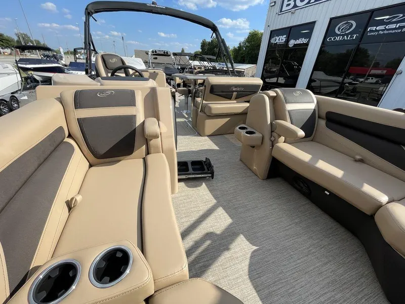 Slide: The Image of 2023 Barletta Cabrio 24 UE pontoon boat with luxurious tan seating and cup holders. - 44