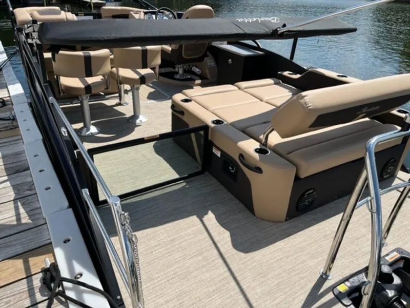 Slide: The Image of 2023 Barletta Cabrio 24 UE pontoon boat with beige seating and black accents. - 6