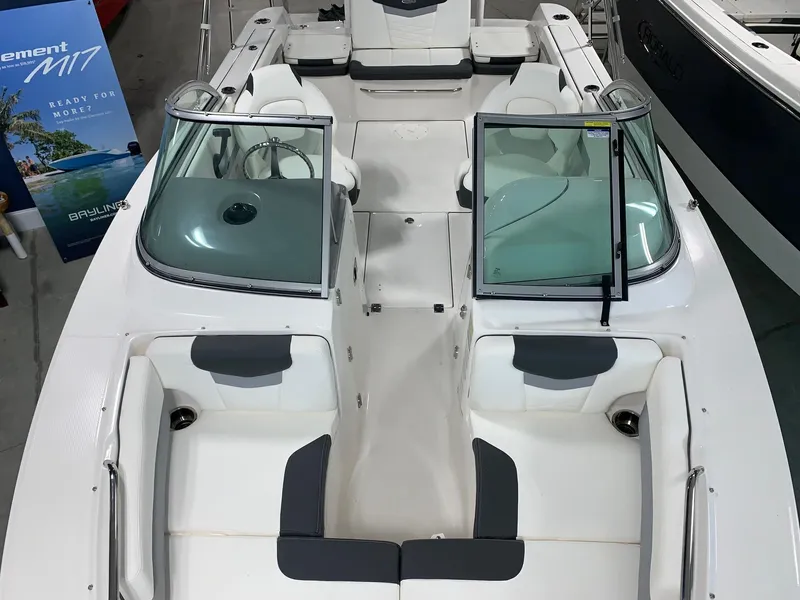 Slide: The Image of 2024 Robalo R207 Dual Console boat interior with seating and windshield. - 3