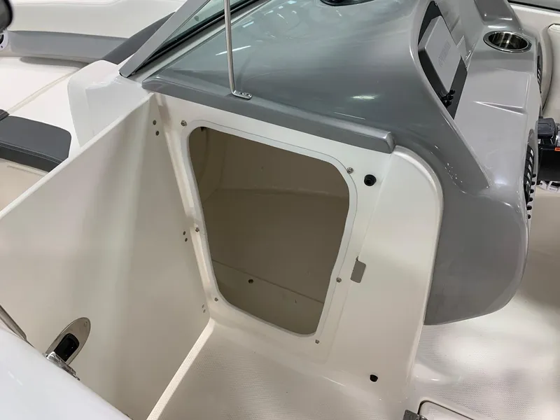 Slide: The Image of 2024 Robalo R207 Dual Console storage compartment. - 6