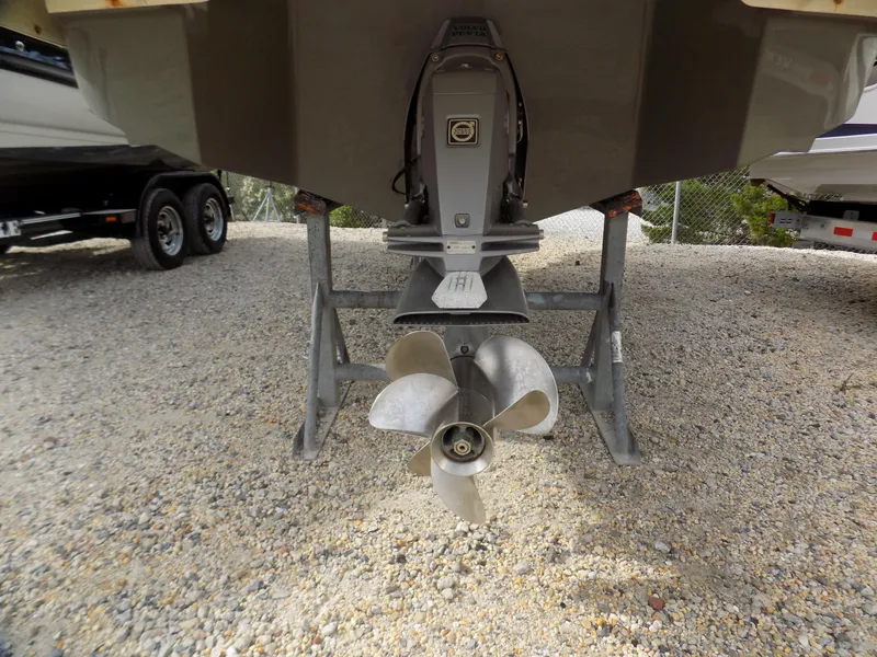 Slide: The Image of 2017 Regal 2500 boat propeller and stern on gravel surface. - 12