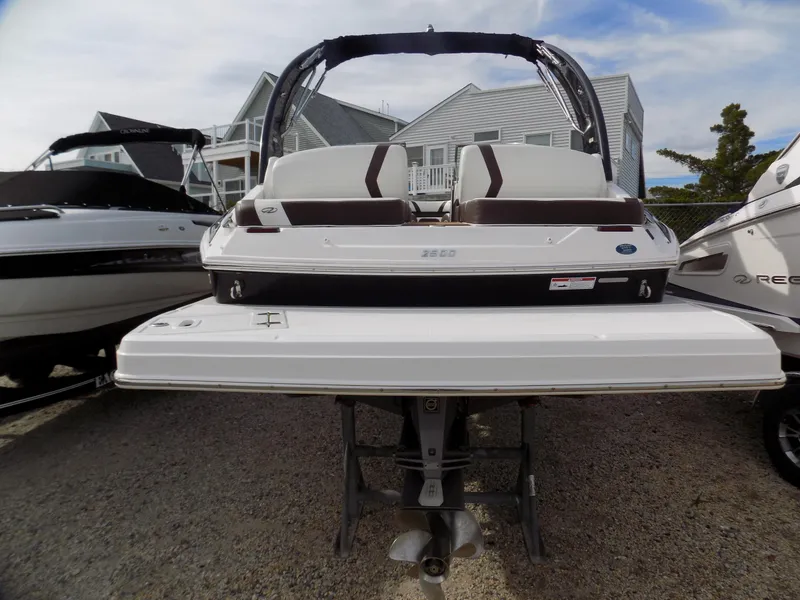 Slide: The Image of 2017 Regal 2500 boat displayed on a stand, rear view with seating and propeller visible. - 2