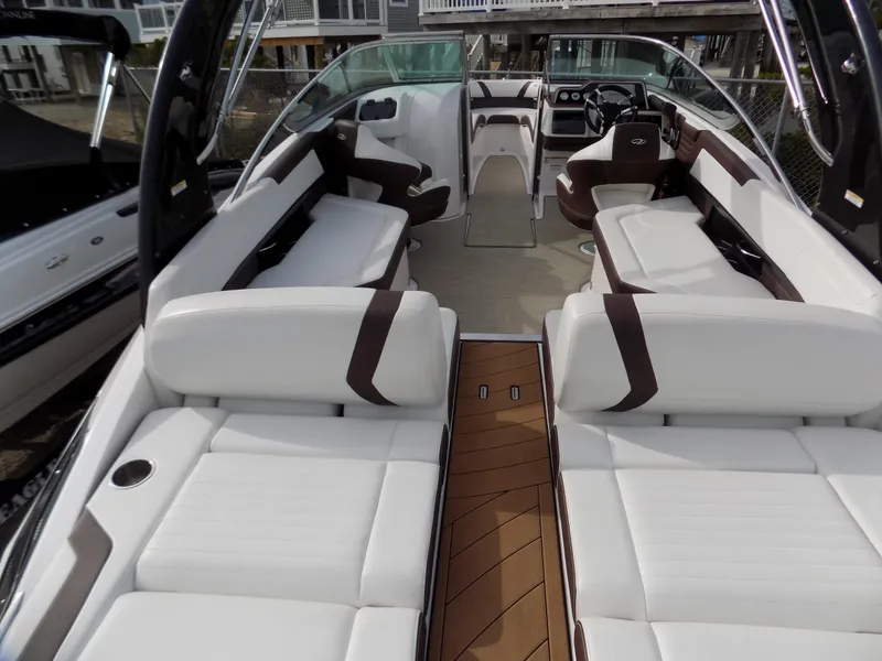 Slide: The Image of 2017 Regal 2500 boat interior with white seating and wood accents. - 3