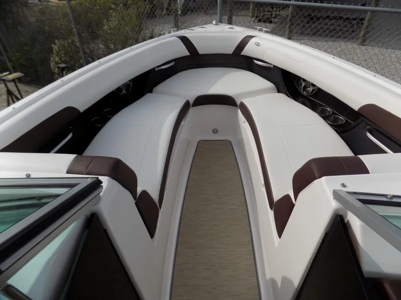 Slide: The Image of 2017 Regal 2500 boat interior with white and brown seating, open bow design. - 4