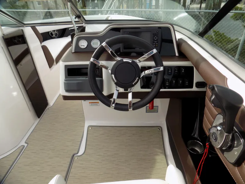 Slide: The Image of 2017 Regal 2500 boat interior with steering wheel and dashboard controls. - 6