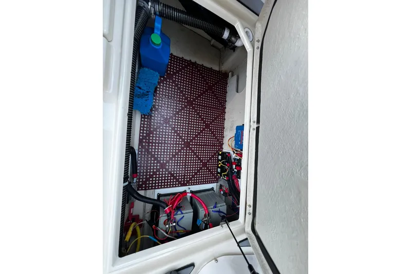 Slide: The Image of 2021 Ranger Tugs R-29S engine compartment with wiring and equipment. - 21