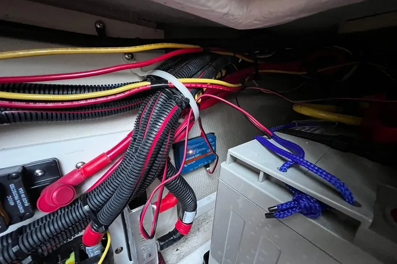 Slide: The Image of Electrical wiring and components inside a 2021 Ranger Tugs R-29S boat. - 24
