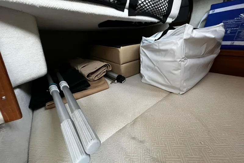 Slide: The Image of Storage area in a 2021 Ranger Tugs R-29S with folded items and equipment. - 7