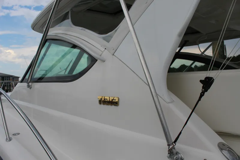 Slide: The Image of 2002 Tiara Yachts 3800 Open, side view of cabin and logo. - 10