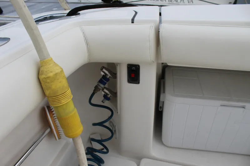 Slide: The Image of Tiara Yachts 3800 Open 2002 model interior with hose, cooler, and seating. - 13