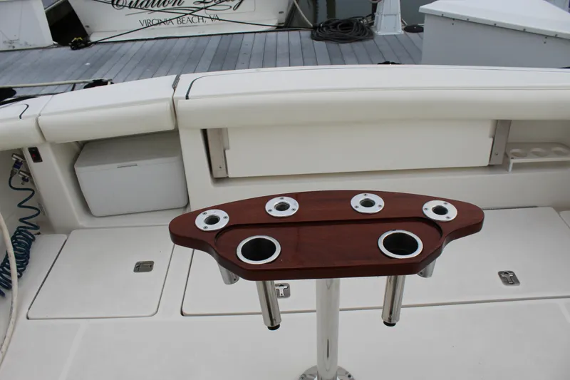 Slide: The Image of Tiara Yachts 3800 Open 2002 model fishing rod holders and seating area. - 14