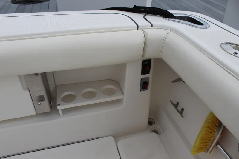 Slide: The Image of 2002 Tiara Yachts 3800 Open boat interior with cup holders and storage compartments. - 15