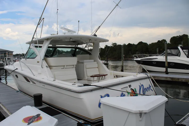 Slide: The Image of 2002 Tiara Yachts 3800 Open docked at a marina. - 2