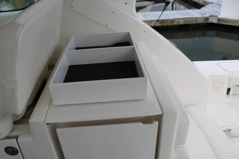 Slide: The Image of Interior of a 2002 Tiara Yachts 3800 Open, featuring storage compartments. - 21