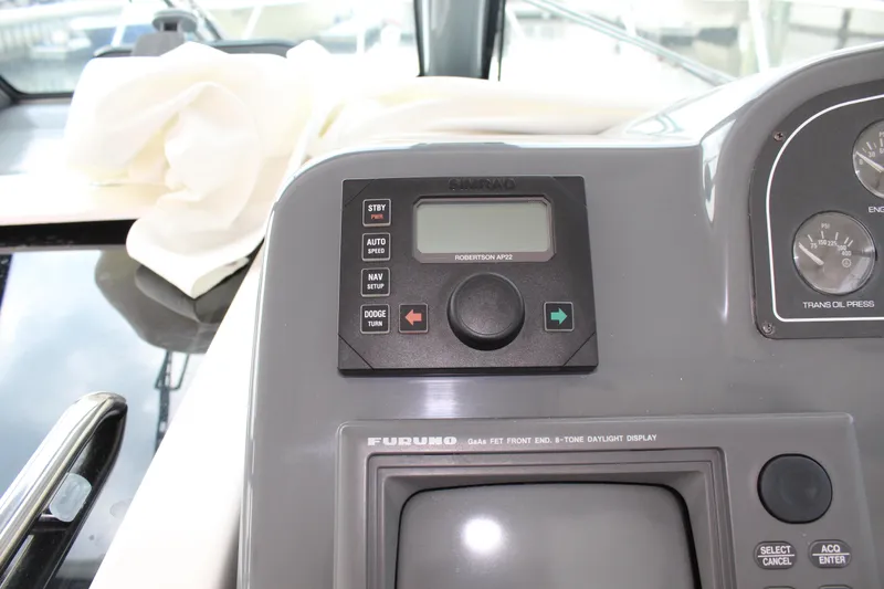 Slide: The Image of Control panel of a 2002 Tiara Yachts 3800 Open with navigation equipment. - 27