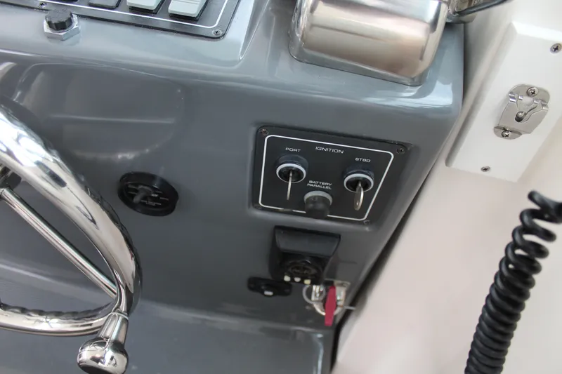 Slide: The Image of Close-up of the 2002 Tiara Yachts 3800 Open helm controls and steering wheel. - 30