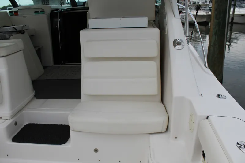 Slide: The Image of 2002 Tiara Yachts 3800 Open interior seating area with white cushioned seat. - 33
