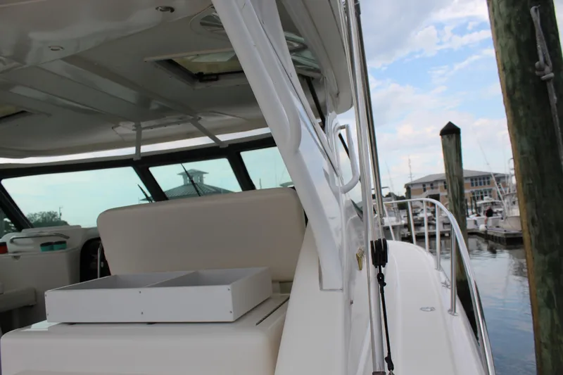 Slide: The Image of 2002 Tiara Yachts 3800 Open at marina, interior view with seating and storage. - 35