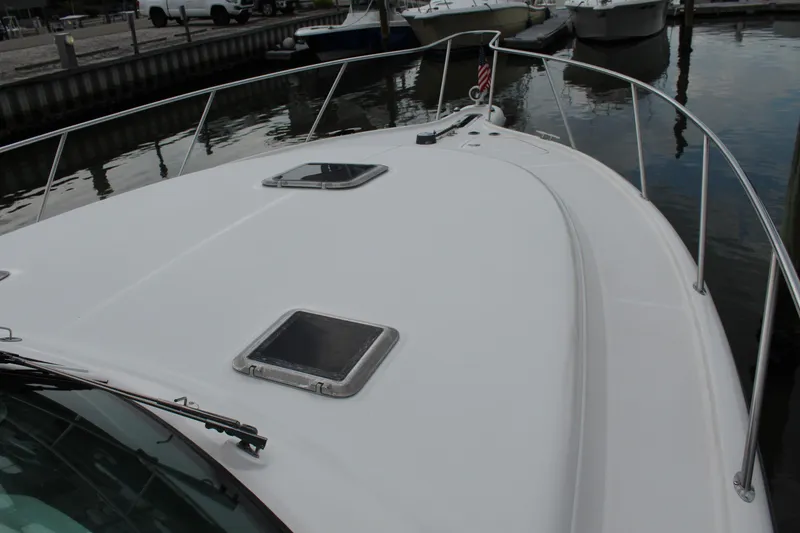 Slide: The Image of 2002 Tiara Yachts 3800 Open boat deck with hatches, docked at marina. - 36