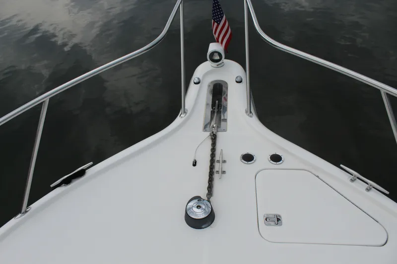Slide: The Image of Bow of 2002 Tiara Yachts 3800 Open with anchor chain and American flag. - 37