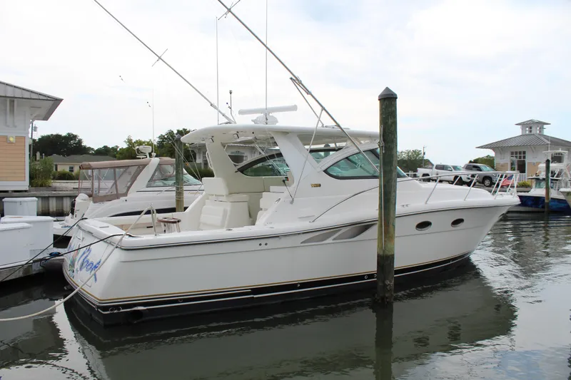 Slide: The Image of 2002 Tiara Yachts 3800 Open docked at a marina. - 4