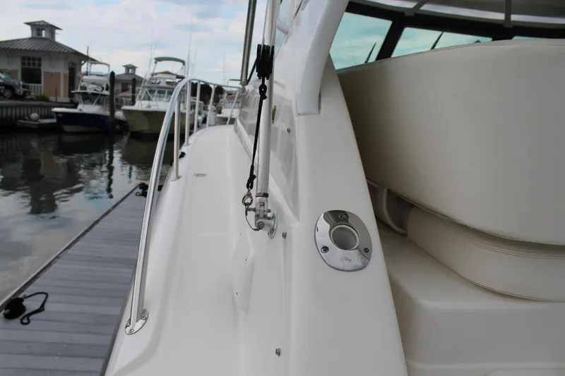 Slide: The Image of 2002 Tiara Yachts 3800 Open docked, side view of deck and seating area. - 43