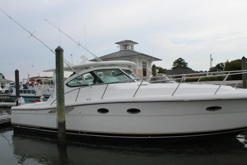 Slide: The Image of 2002 Tiara Yachts 3800 Open docked at a marina. - 5