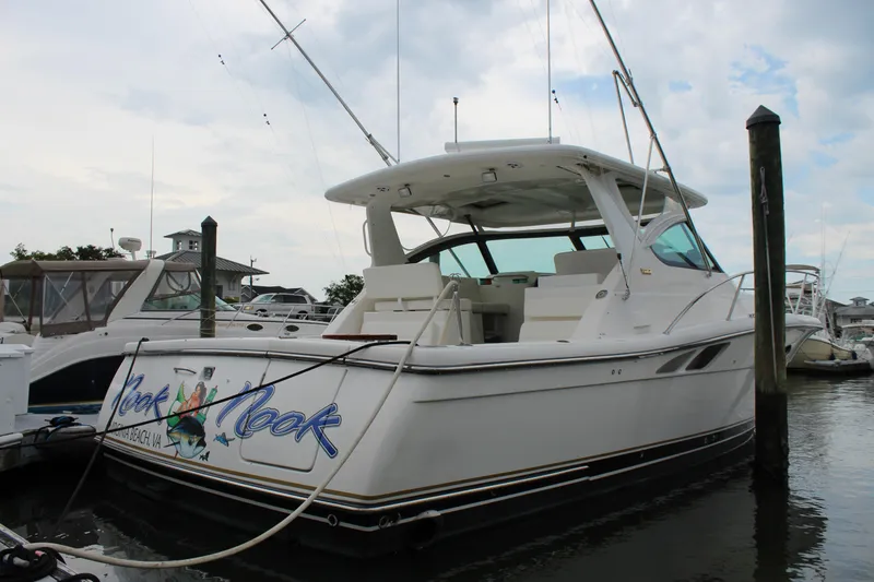 Slide: The Image of 2002 Tiara Yachts 3800 Open docked at a marina. - 7