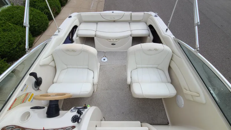 Slide: The Image of 2002 Sea Ray 225 Weekender boat interior with white leather seats. - 7