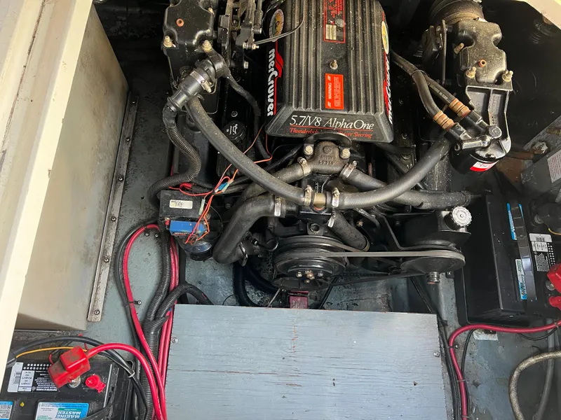 Slide: The Image of Engine compartment of a 1991 Sea Ray Sundancer 220 boat, featuring a 5.7L V8 Alpha One engine. - 4