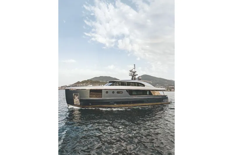 Slide: The Image of 2023 Azimut Magellano 30M luxury yacht cruising on open water. - 11