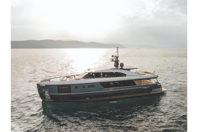 Slide: The Image of 2023 Azimut Magellano 30M yacht cruising on open water at sunset. - 17