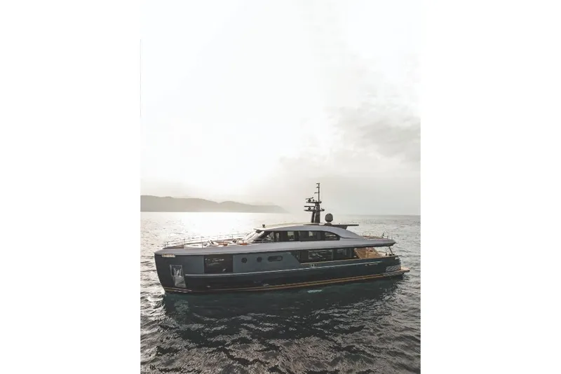Slide: The Image of 2023 Azimut Magellano 30M yacht cruising on open water at sunset. - 19