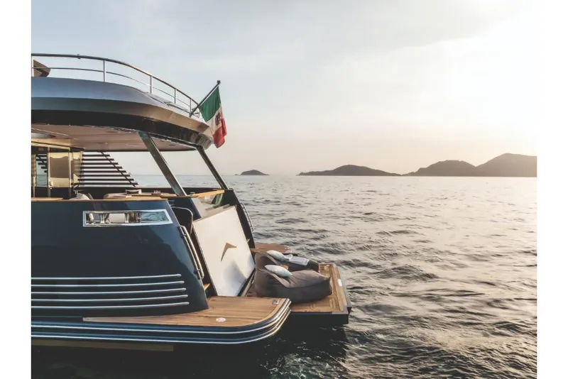 Slide: The Image of 2023 Azimut Magellano 30M yacht at sunset on the open sea. - 26