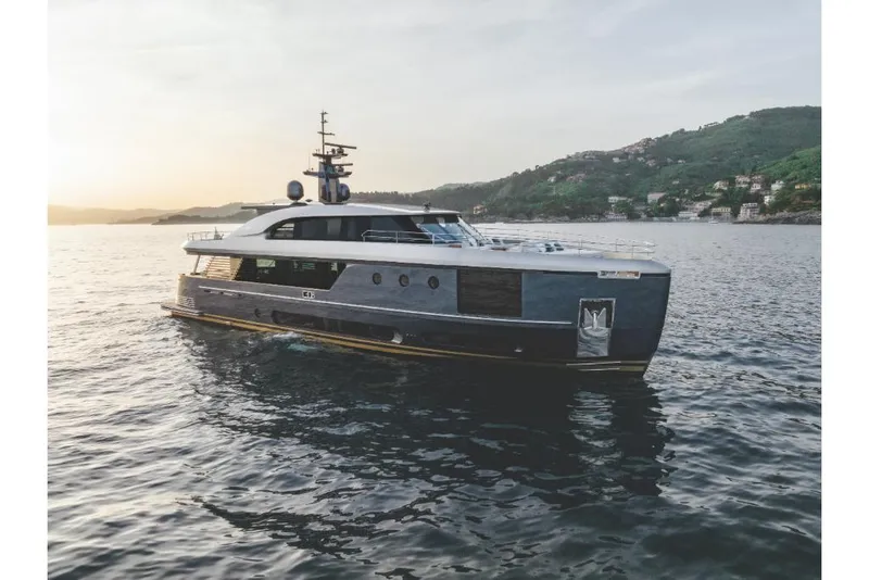 Slide: The Image of 2023 Azimut Magellano 30M luxury yacht cruising on serene waters at sunset. - 27