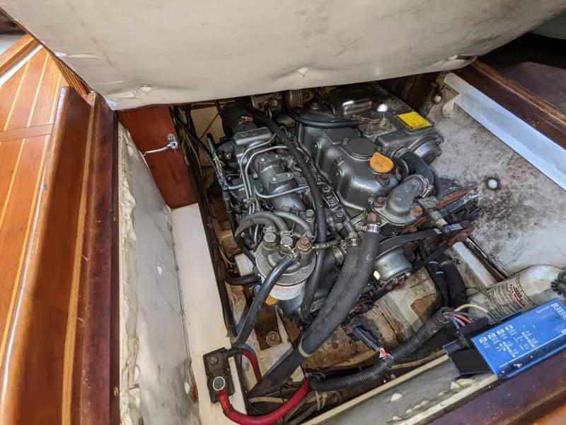 Slide: The Image of Engine compartment of a 1995 Freedom 40/40 boat, showcasing mechanical components and wiring. - 21
