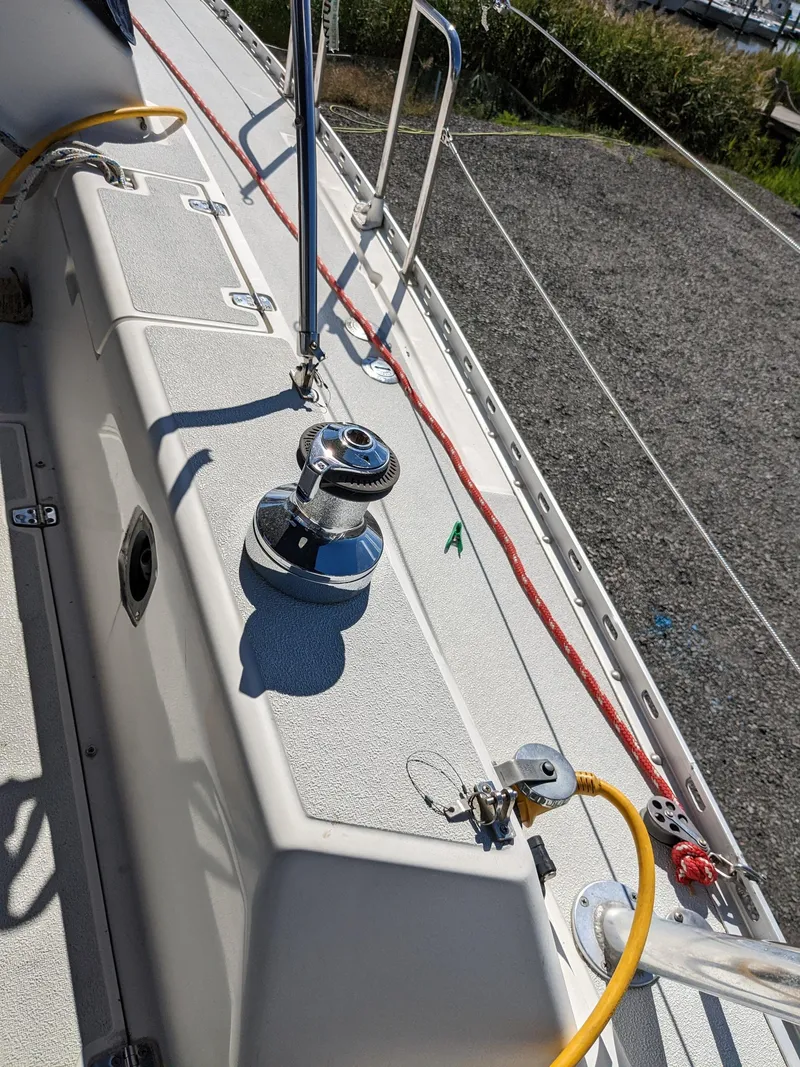 Slide: The Image of Deck of a 1995 Freedom 40/40 sailboat with winch and ropes. - 7