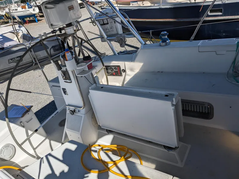 Slide: The Image of Cockpit of a 1995 Freedom 40/40 sailboat with steering wheel and navigation equipment. - 8
