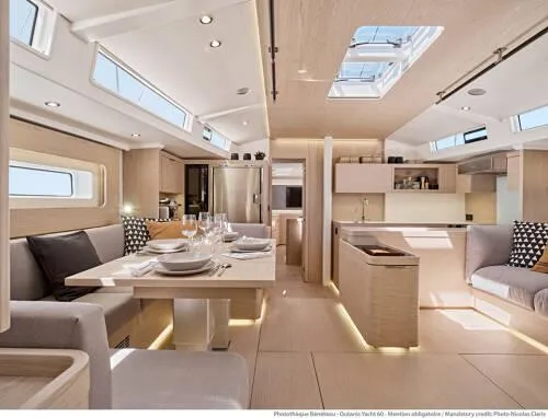 Slide: The Image of Luxurious interior of 2026 Beneteau Oceanis Yacht 60 with modern dining and kitchen area. - 10