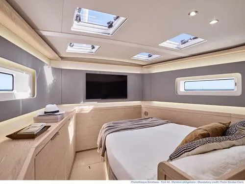 Slide: The Image of Luxurious interior of 2026 Beneteau Oceanis Yacht 60 with modern bedroom design. - 15
