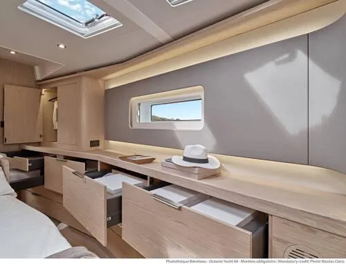 Slide: The Image of Luxurious interior of 2026 Beneteau Oceanis Yacht 60 with modern cabinetry and natural lighting. - 18